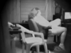 A lonely wife's foolish masturbation is captured on a concealed camera.
